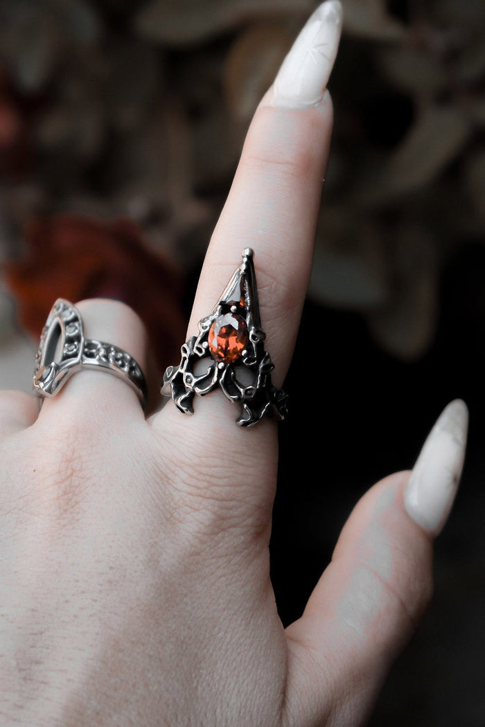 gothic enchanting looking stainless steel ring with red stone