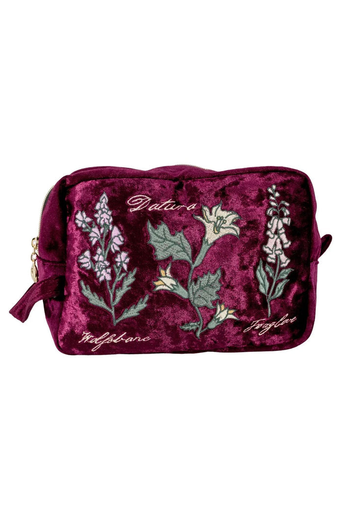 makeup bag with burgundy crushed velvet, pink satin lining, and a gold zipper