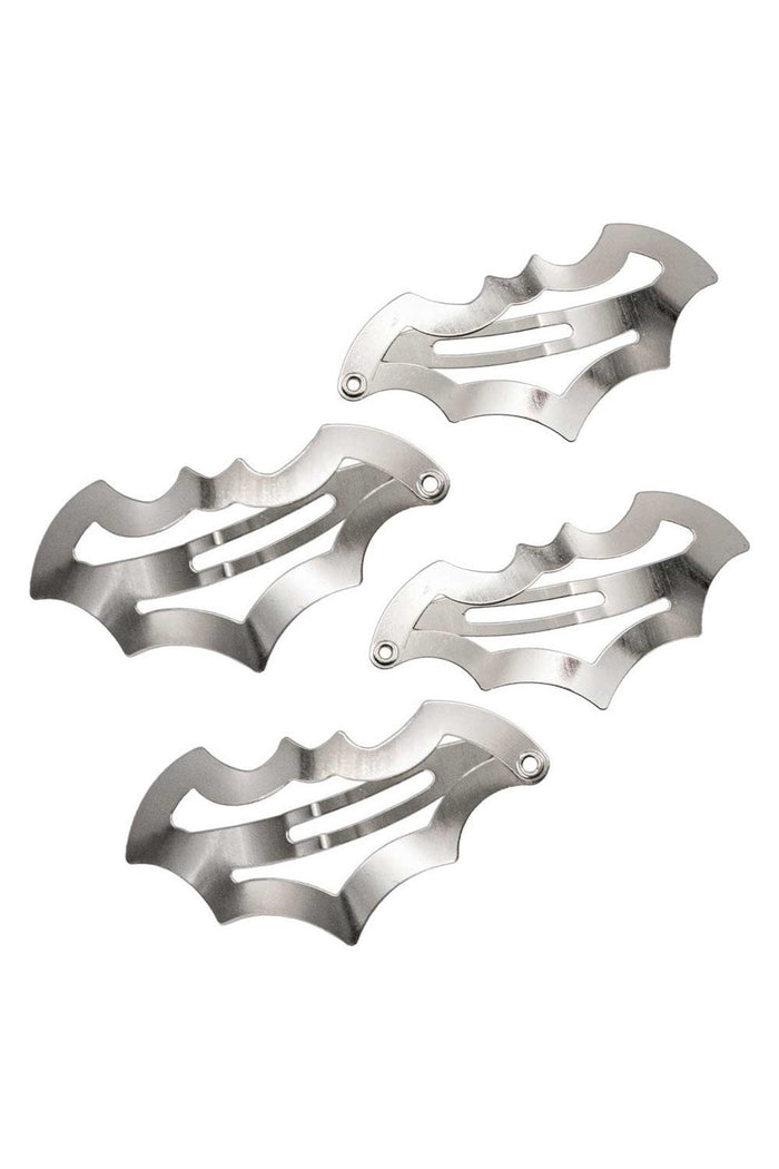 Four metallic bat-shaped hair clips on a white background