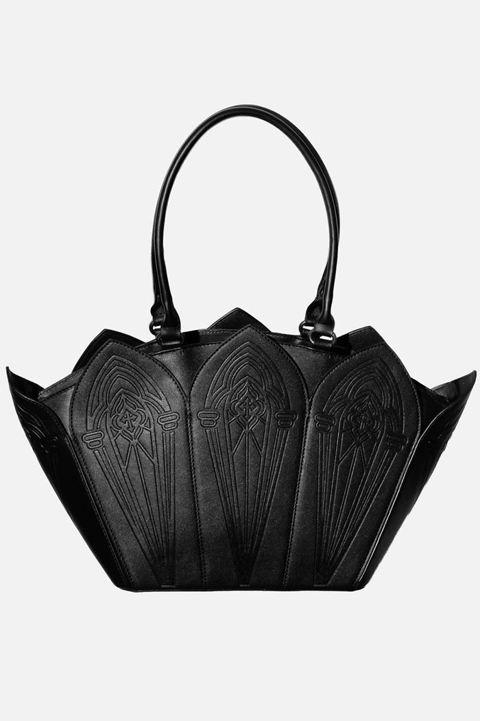 Black handbag with decorative patterns on a white background