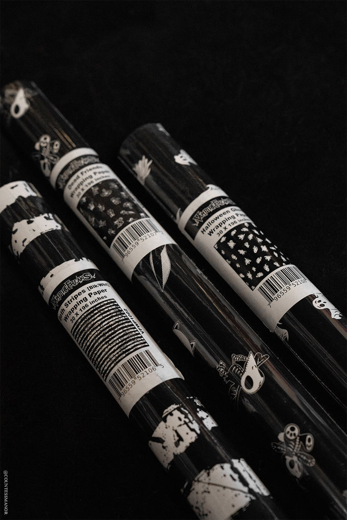 gothic skeleton wrapping paper  adn other rolls of goth gift wrap