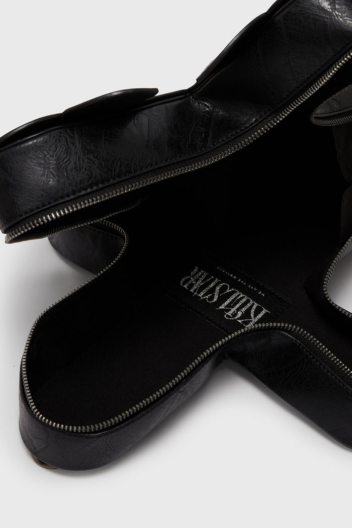 inside a gothic cross shaped novelty bag by killstar