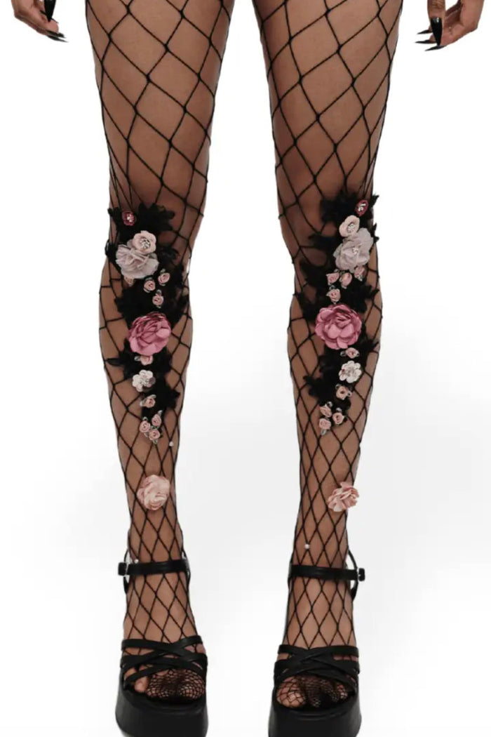 faux flower and leave attached to fishnet stockings