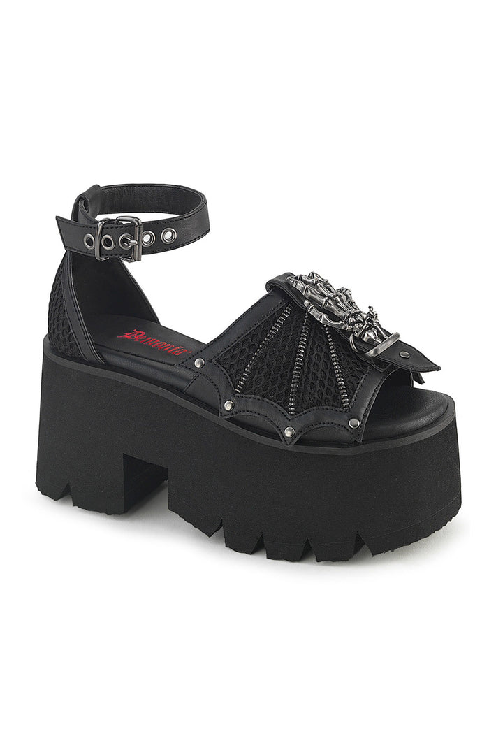 Black platform sandal with decorative straps on a white background