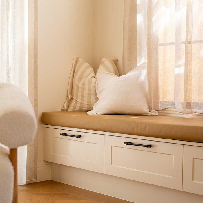 Momo Handles Maida Pulls in Black featured in window seat unit in modern Australian interior - the Blue Space