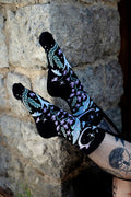 dark fantasy knitted socks featuring moons, moths, and flowers