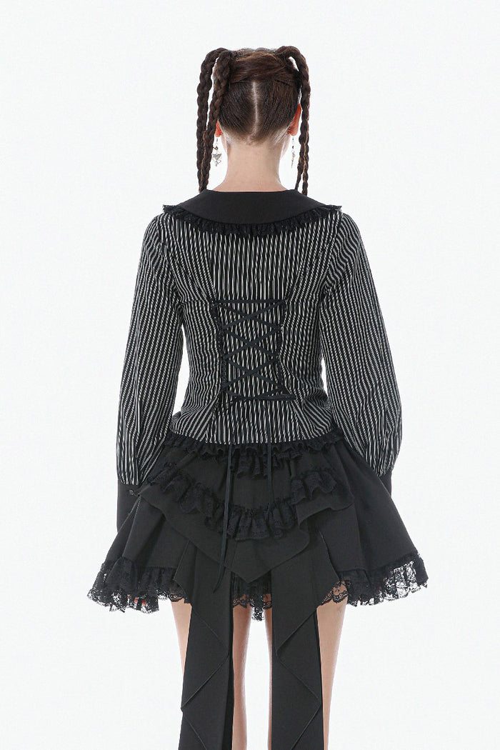 gothic woman wearing a long sleeves womens striped blouse with puffed sleeves and corset back