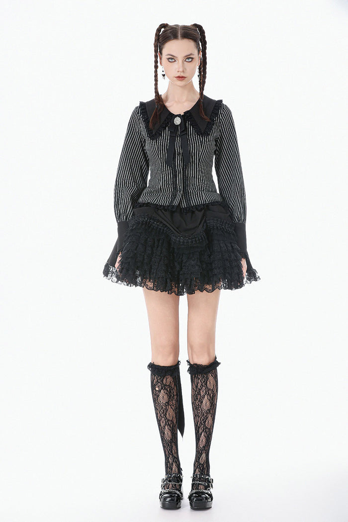 gothic woman wearing a long sleeves womens striped blouse with puffed sleeves and bowtie