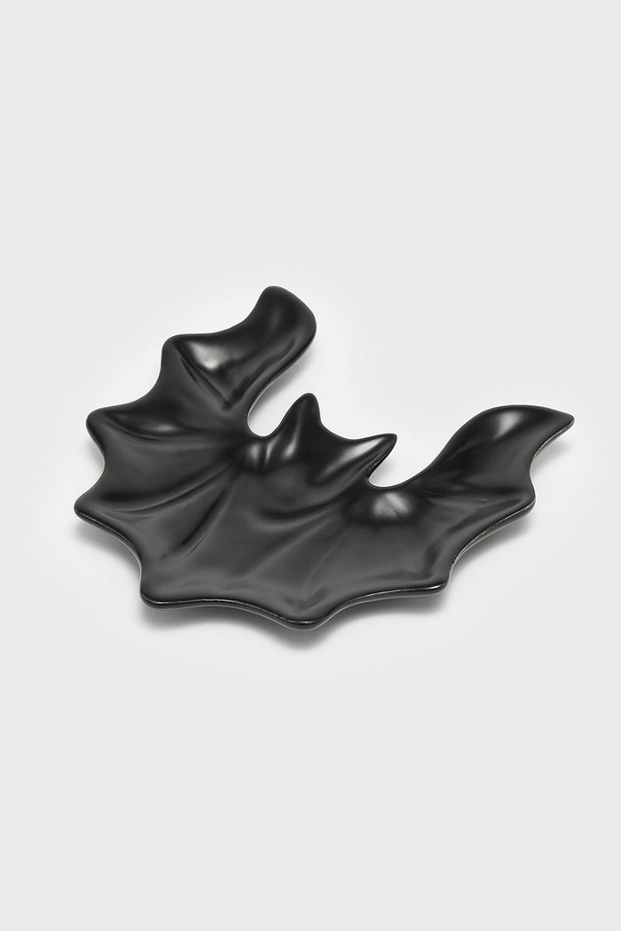 black ceramic bat-shaped spoon rest