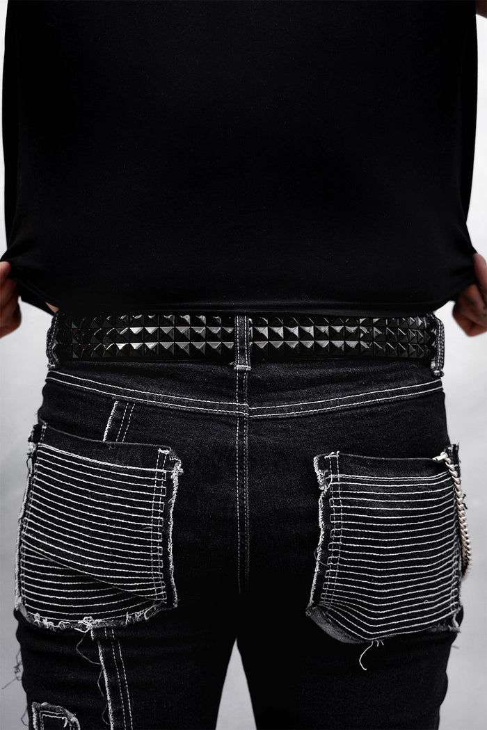 authentic genuine real leather black pyramid studded punk belt worn by a man with tattoos named @onelowsoul