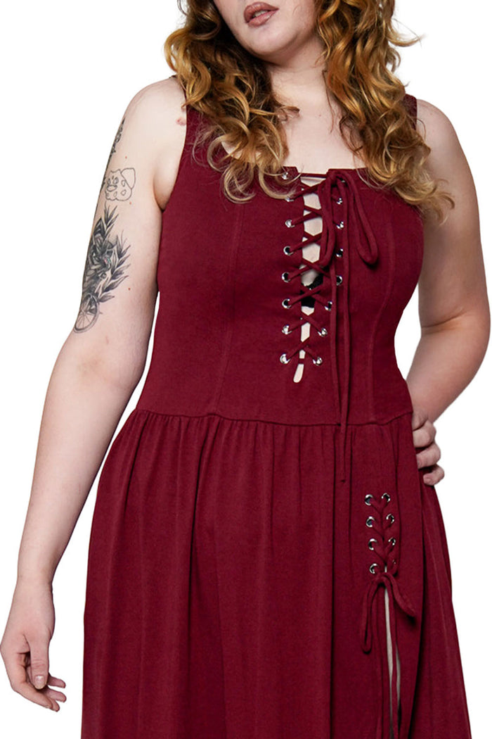 oxblood red dress with drop waist, adjustable straps, and adjustable corset details
