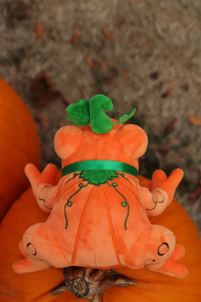 Halloween themed pumpkin inspired orange toad plush toy with green ribbon