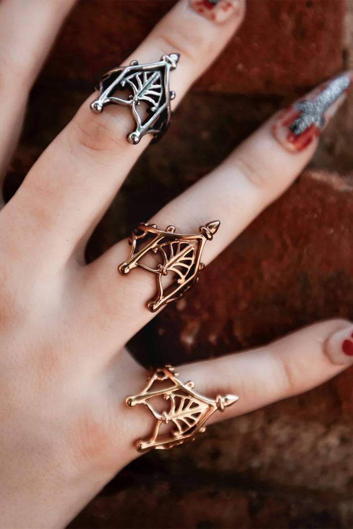 Model wearing Sacred Arches Rings in various colors