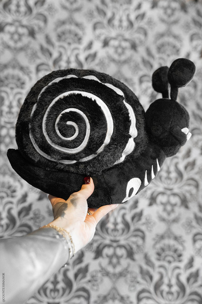 black and white embroidered skeleton snail plushie stuffed animal