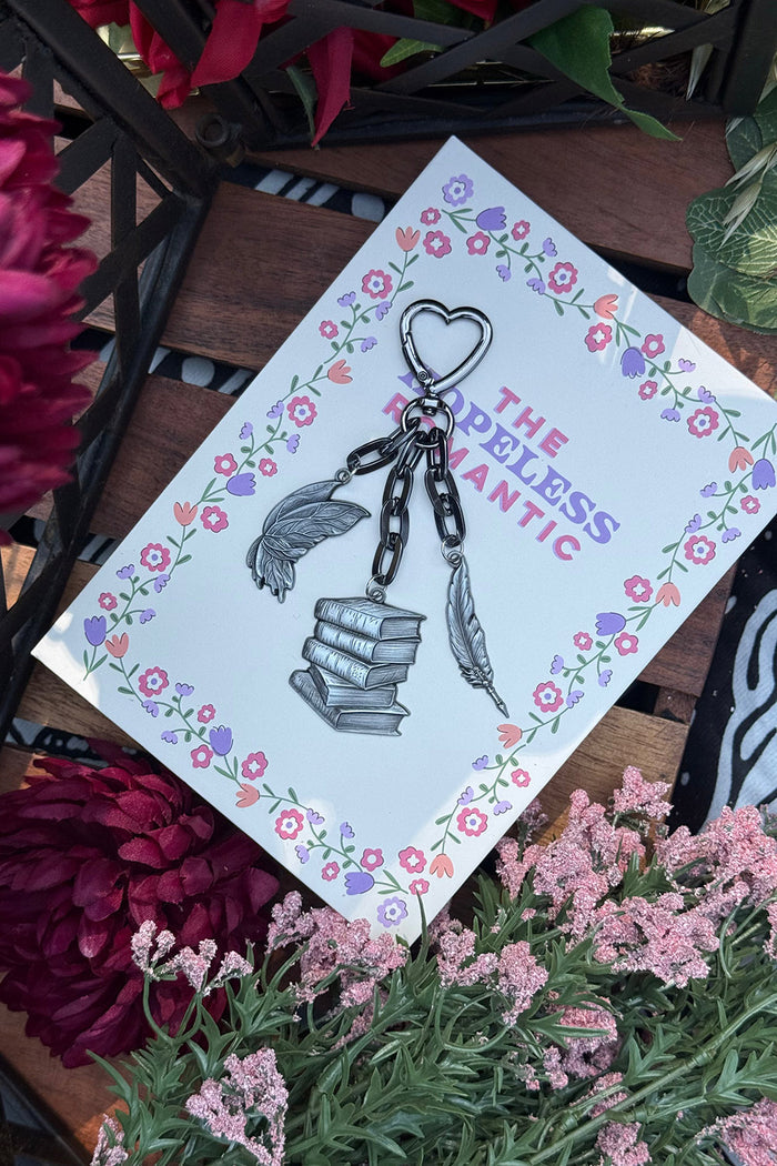 spooky feather quill, heart hook, book stack and mothwings keychain