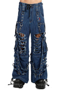 Distressed blue jeans with multiple straps and buckles on a white background