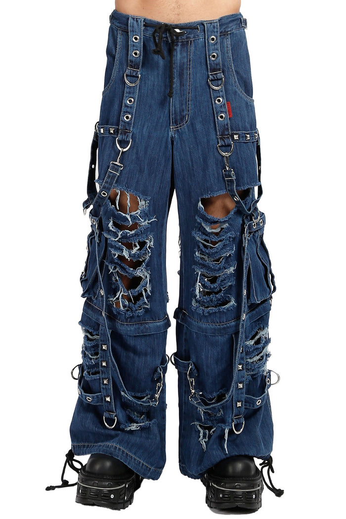 Distressed blue jeans with multiple straps and buckles on a white background