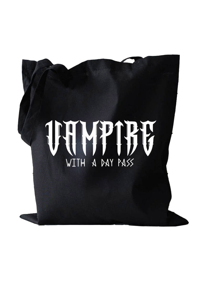 Black tote bag with 'Vampire with a Day Pass' text on a white background