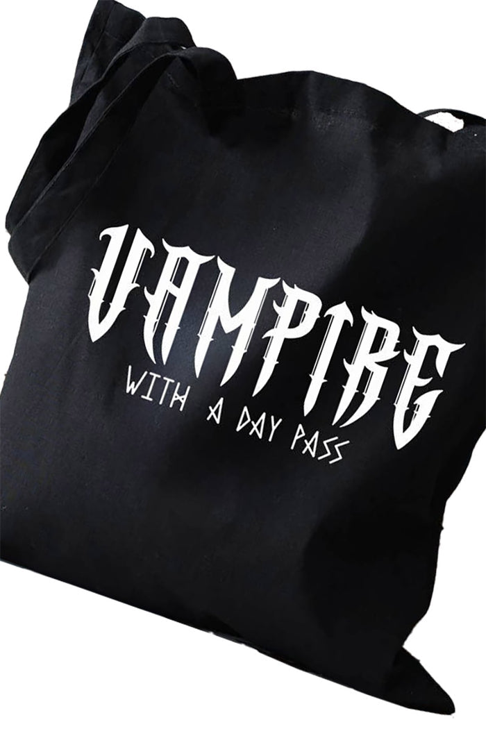 Black goth tote bag with 'Vampire with a Day Pass' text on a white background