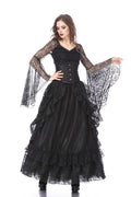 Woman wearing a black gothic-style dress with sheer sleeves on a white background