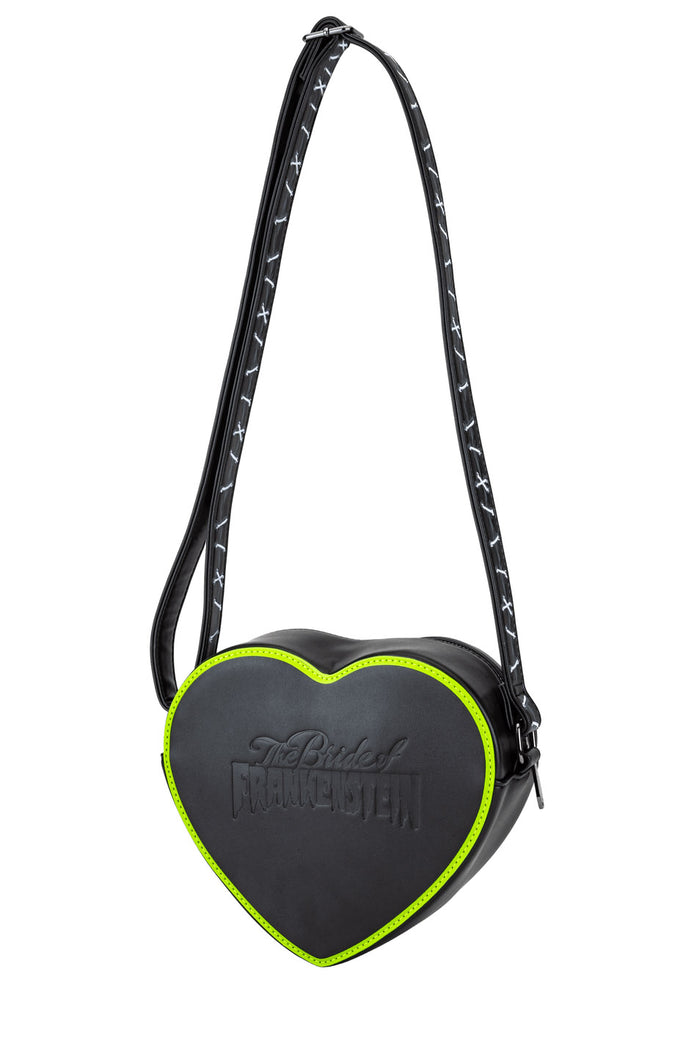 Heart-shaped bag with black and green design on a white background