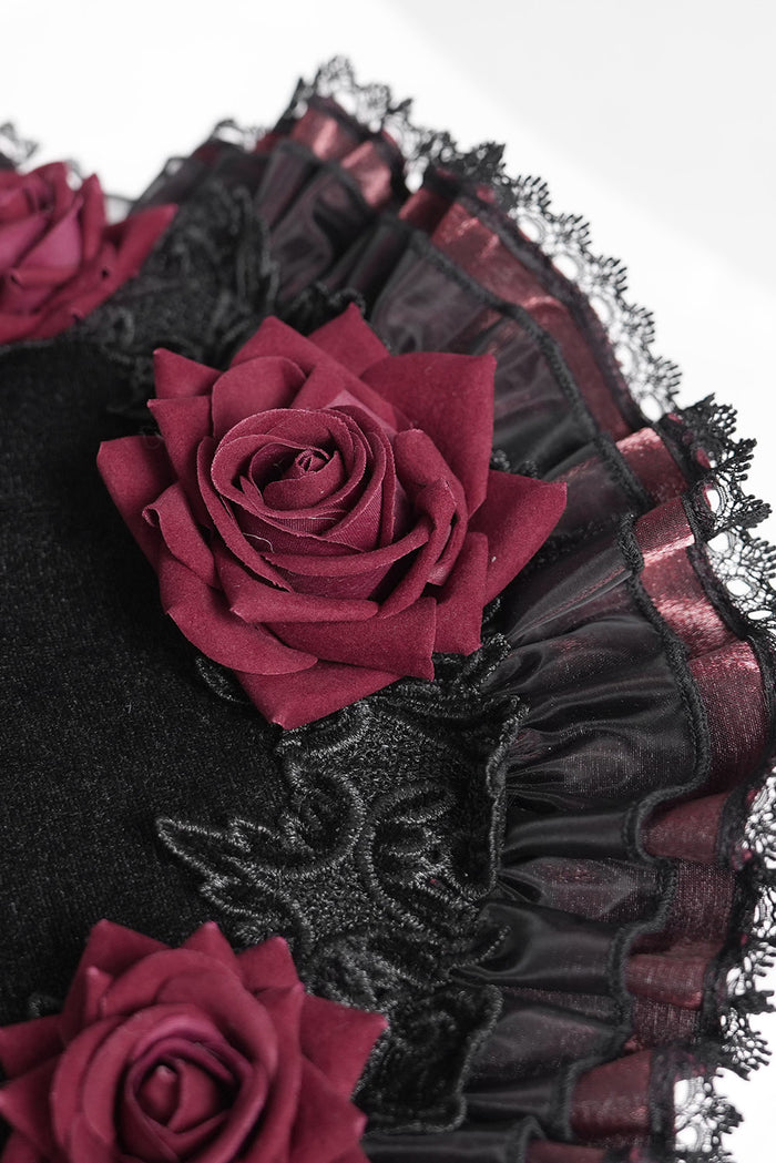 gothic lace and ruffled wide brimmed witch hat with red roses