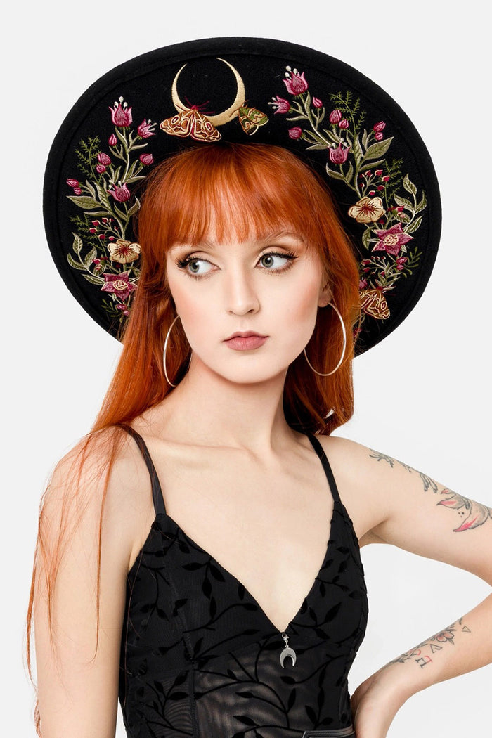 embroidered butterfly, crescent moon, and flower hat