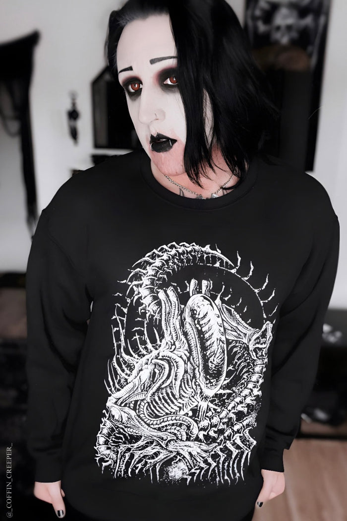 dark sci fi sweater with gothic alien graphic